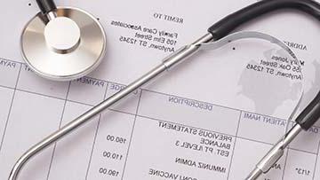 Stethoscope lying on patient chart.